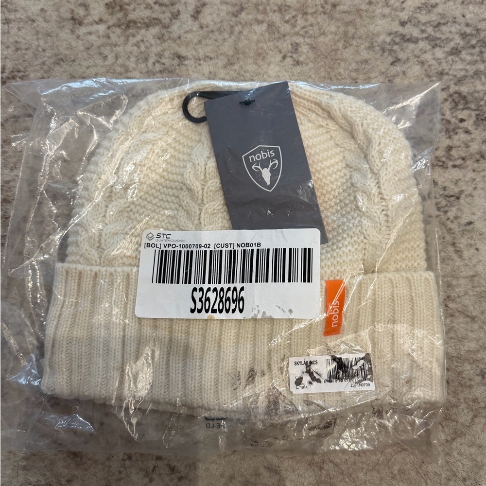 Nobis No Cold Shoulder Cable Knit Beanie in Cream